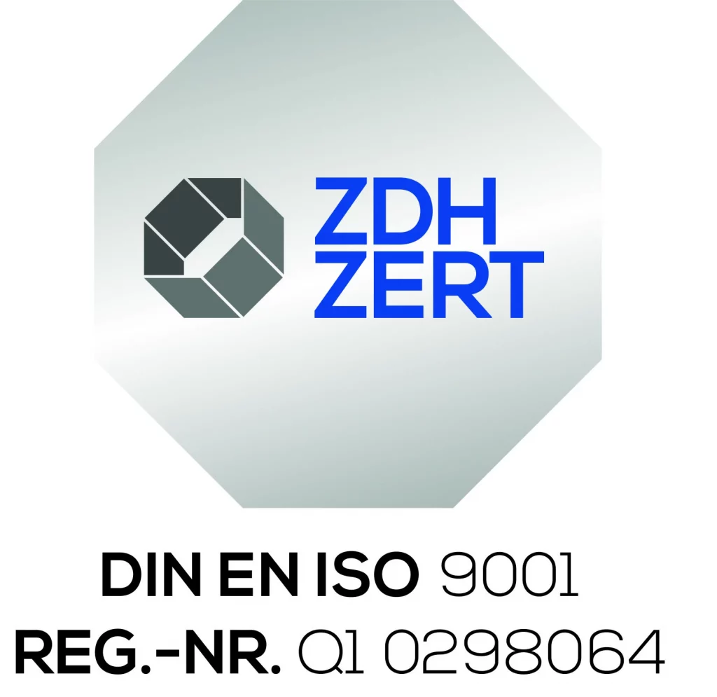 ZDH ZERT-Logo mit einer grauen geometrischen Form und blauem Text. Darunter steht: DIN EN ISO 9001 REG.-NR. Q1 0298064 in schwarzer Schrift auf weißem Hintergrund.