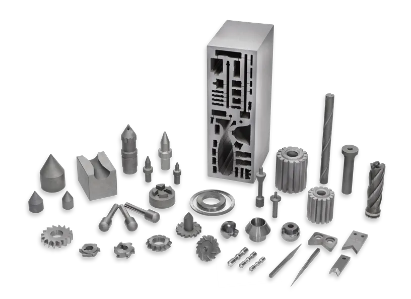 Das Bild zeigt eine große Übersicht an Hartmetall-Teilen, von der Spritzdüse, über Messer, Ringe bis hin zu Bohrern. Dies alles kann Negele-Hartmetalltechnik nach Zeichnung für Sie fertigen.